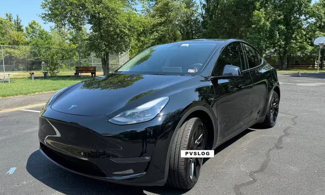 2023 Tesla Model Y Long Range AWD in Solid Black — Front Right