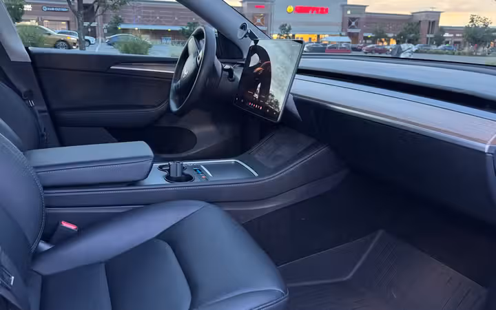 2023 Tesla Model Y Long Range AWD in Solid Black — Front Seats