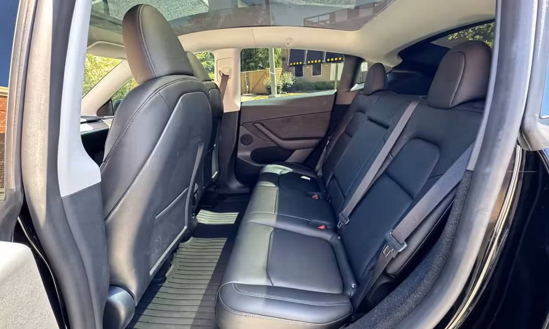 2023 Tesla Model Y Long Range AWD in Solid Black — Rear Seats