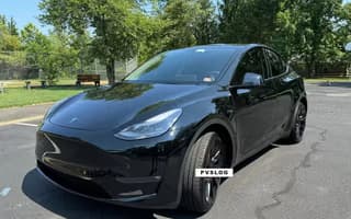 2023 Tesla Model Y Long Range AWD in Solid Black — Front Right