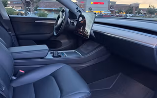 2023 Tesla Model Y Long Range AWD in Solid Black — Front Seats