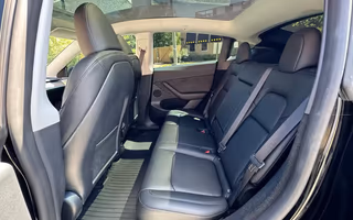 2023 Tesla Model Y Long Range AWD in Solid Black — Rear Seats