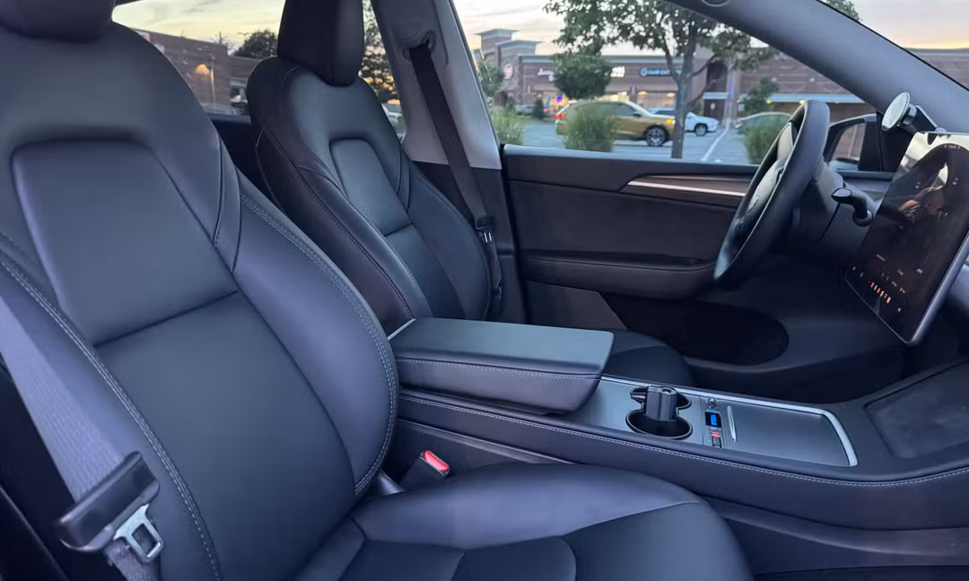 2023 Tesla Model Y Long Range AWD in Solid Black — Front Seats