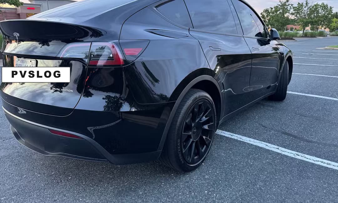 2023 Tesla Model Y Long Range AWD in Solid Black — Rear Angle