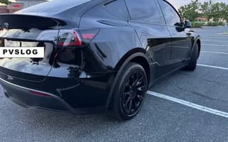2023 Tesla Model Y Long Range AWD in Solid Black — Rear Angle