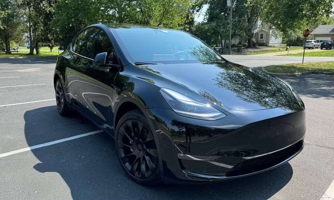 2023 Tesla Model Y Long Range AWD in Solid Black — Front Right