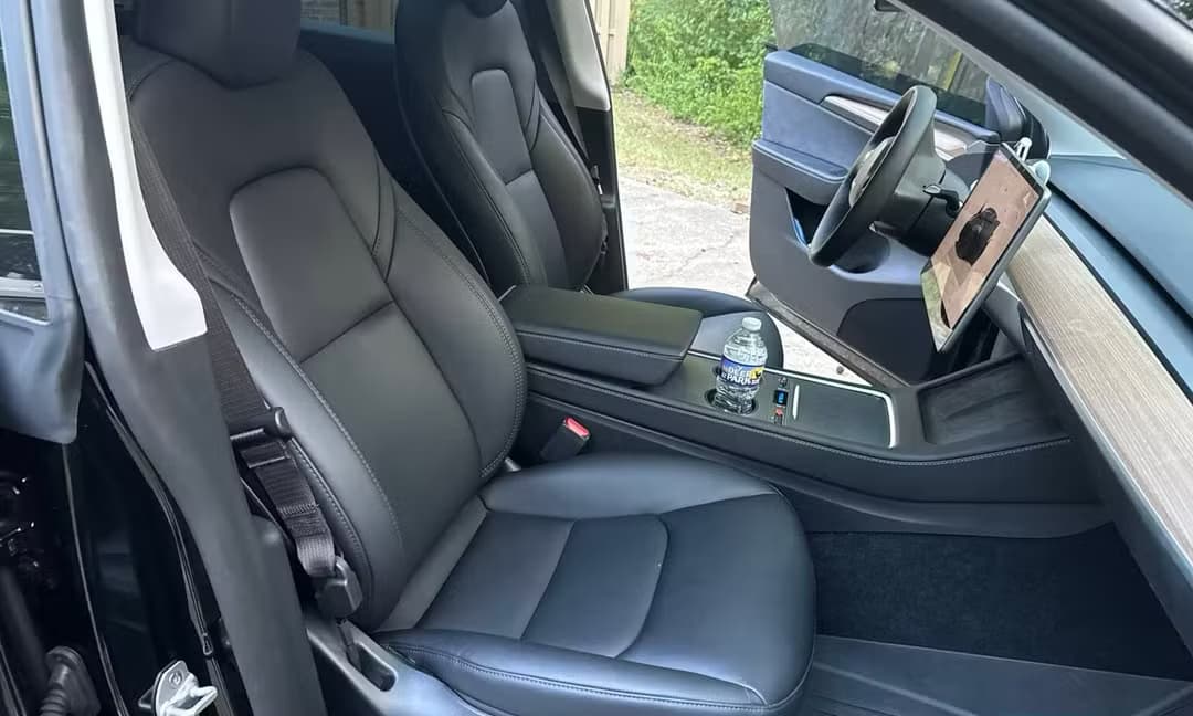 2023 Tesla Model Y Long Range AWD in Solid Black — Front Seats