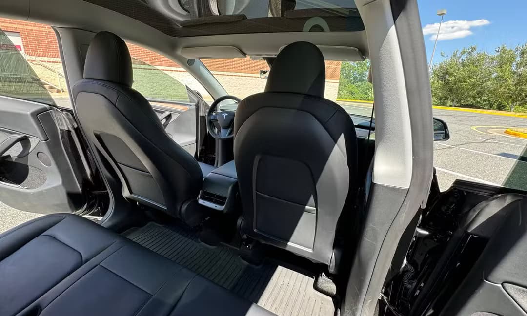 2023 Tesla Model Y Long Range AWD in Solid Black — Rear Seats