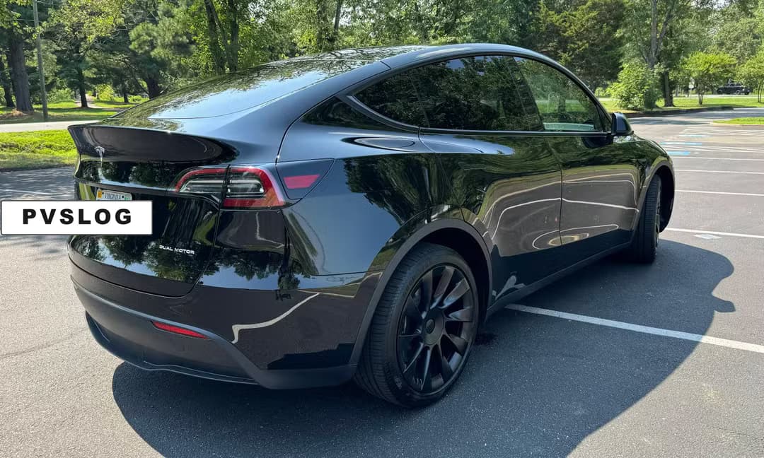 2023 Tesla Model Y Long Range AWD in Solid Black — Rear Angle