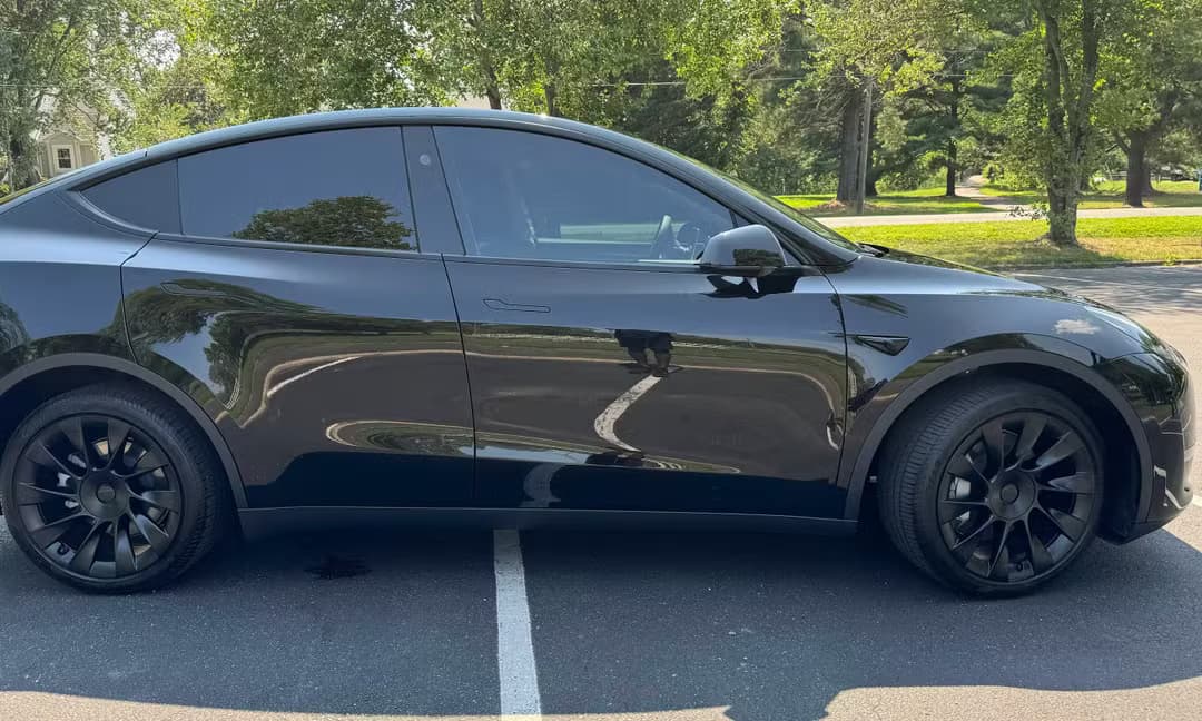 2023 Tesla Model Y Long Range AWD in Solid Black — Side Profile
