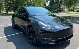 2023 Tesla Model Y Long Range AWD in Solid Black — Front Right