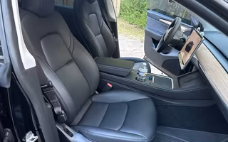 2023 Tesla Model Y Long Range AWD in Solid Black — Front Seats