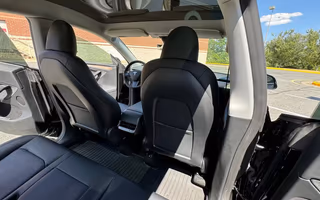 2023 Tesla Model Y Long Range AWD in Solid Black — Rear Seats