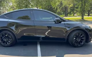 2023 Tesla Model Y Long Range AWD in Solid Black — Side Profile